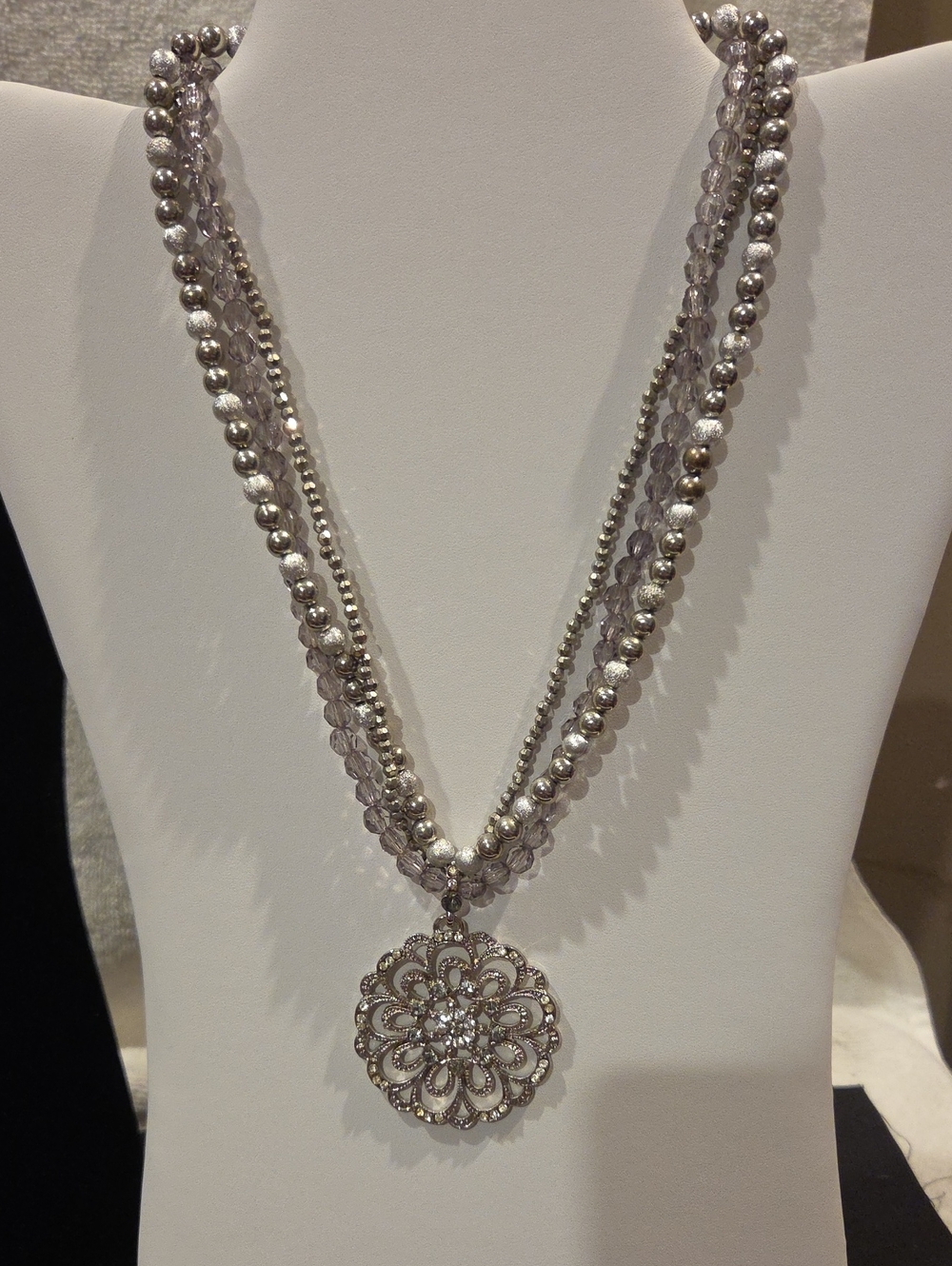 THREE STRAND NECKLACE WITH LARGE MEDALLION